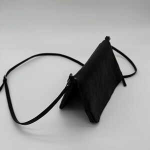 Black leather foldover clutch/crossbody bag by Swedish label, Hope